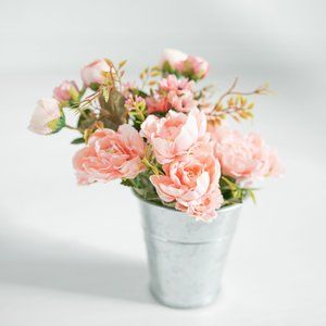 Floral arrangement + tin vase